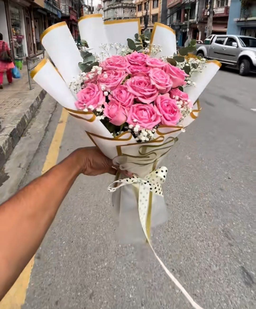 Pink rose bouquet in cream and gold wrapping